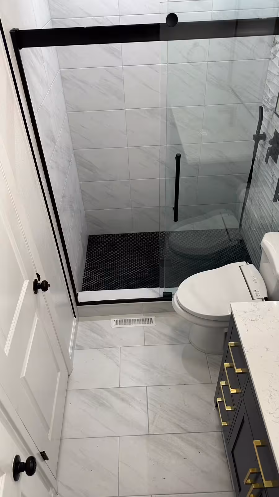 Finished Aurora bathroom remodel with walk-in shower new toilet and vanity