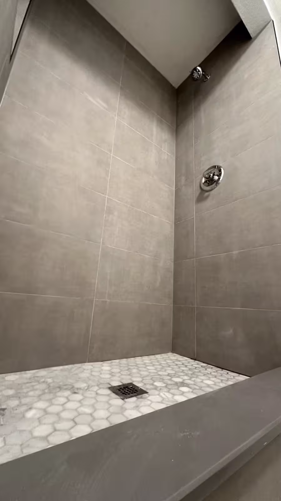 Finished mosaic shower floor and drain in Arvada shower rebuild