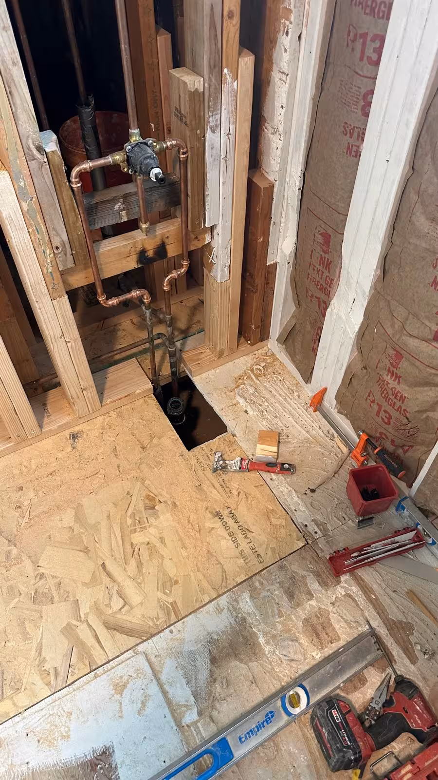 New subfloor and shower plumbing rough-in during Arvada rebuild