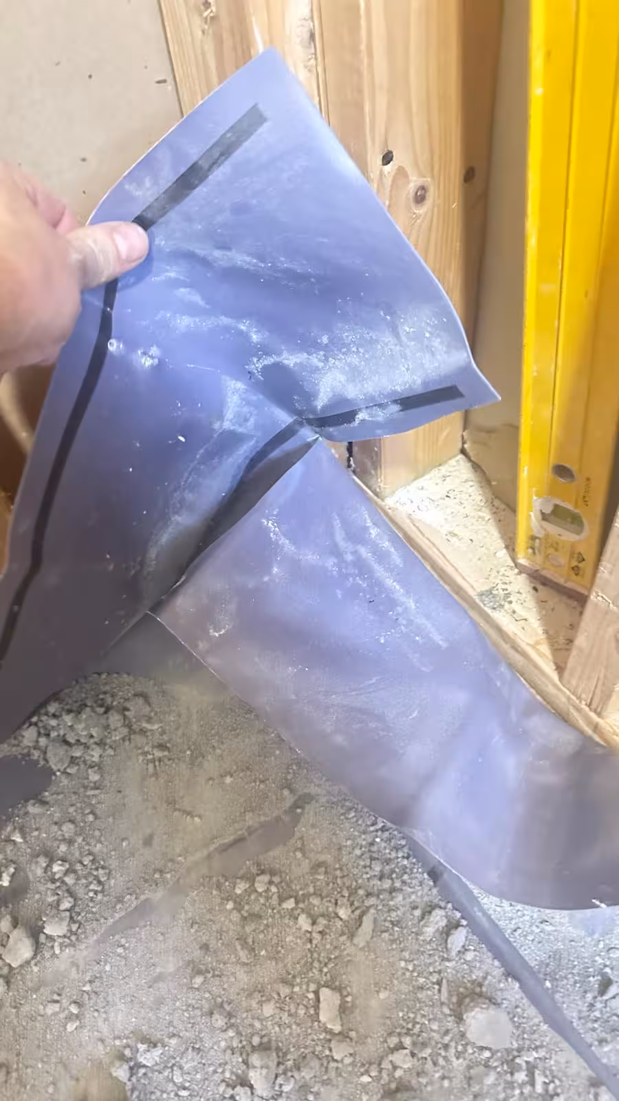 Contractor shower pan error in Denver CO showing poor waterproof seal at corner transition