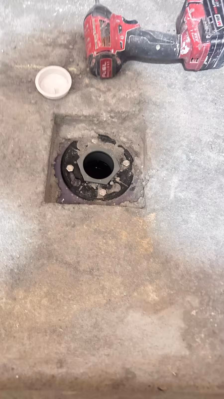 Traditional shower drain opening showing incomplete drain assembly in Denver CO