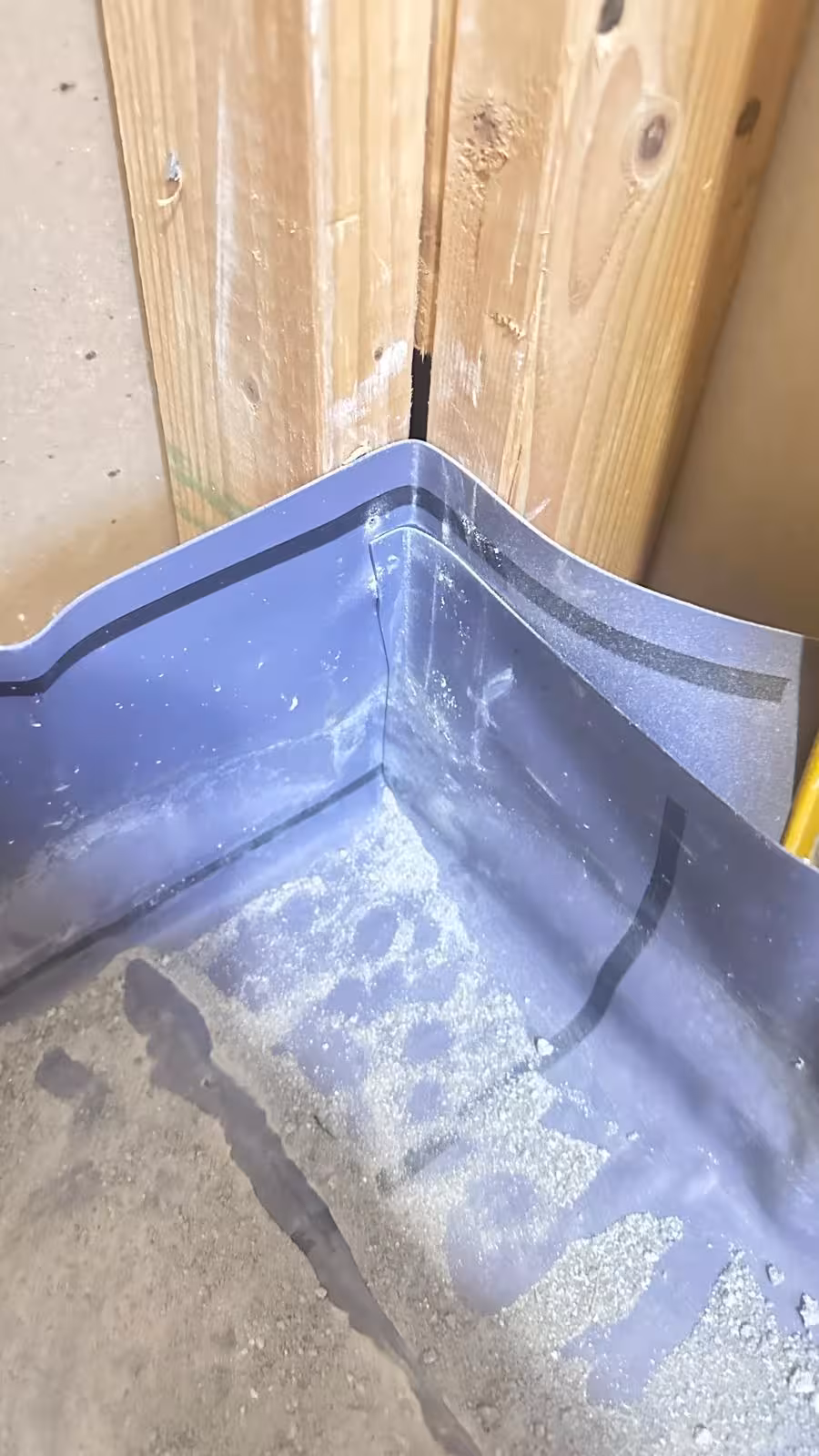 Misaligned PVC shower liner corner during Denver inspection