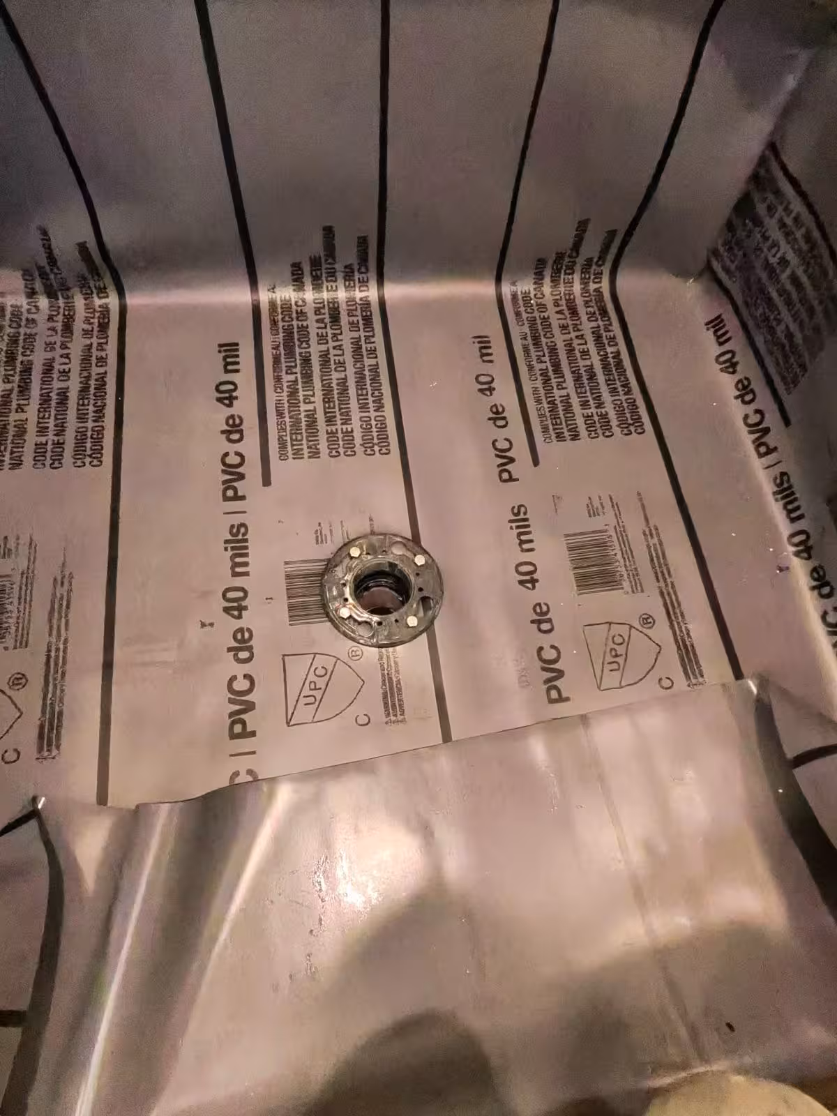 Completed drain installation in shower pan with PVC liner Denver