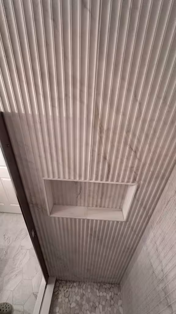 Installing custom soap niche in textured vertical tile shower wall