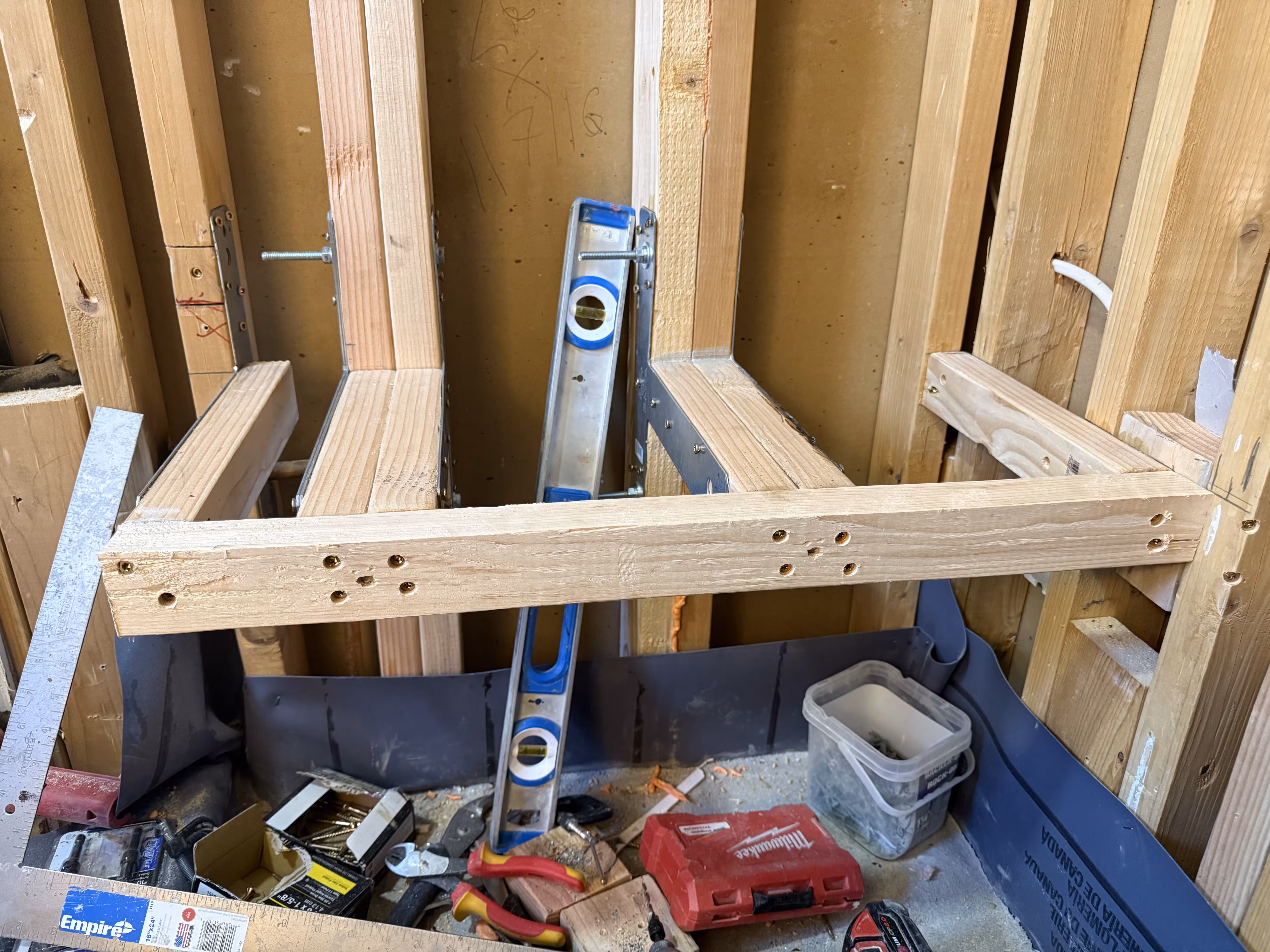 Custom shower curb framing close-up during corrective shower rebuild in Highlands Ranch