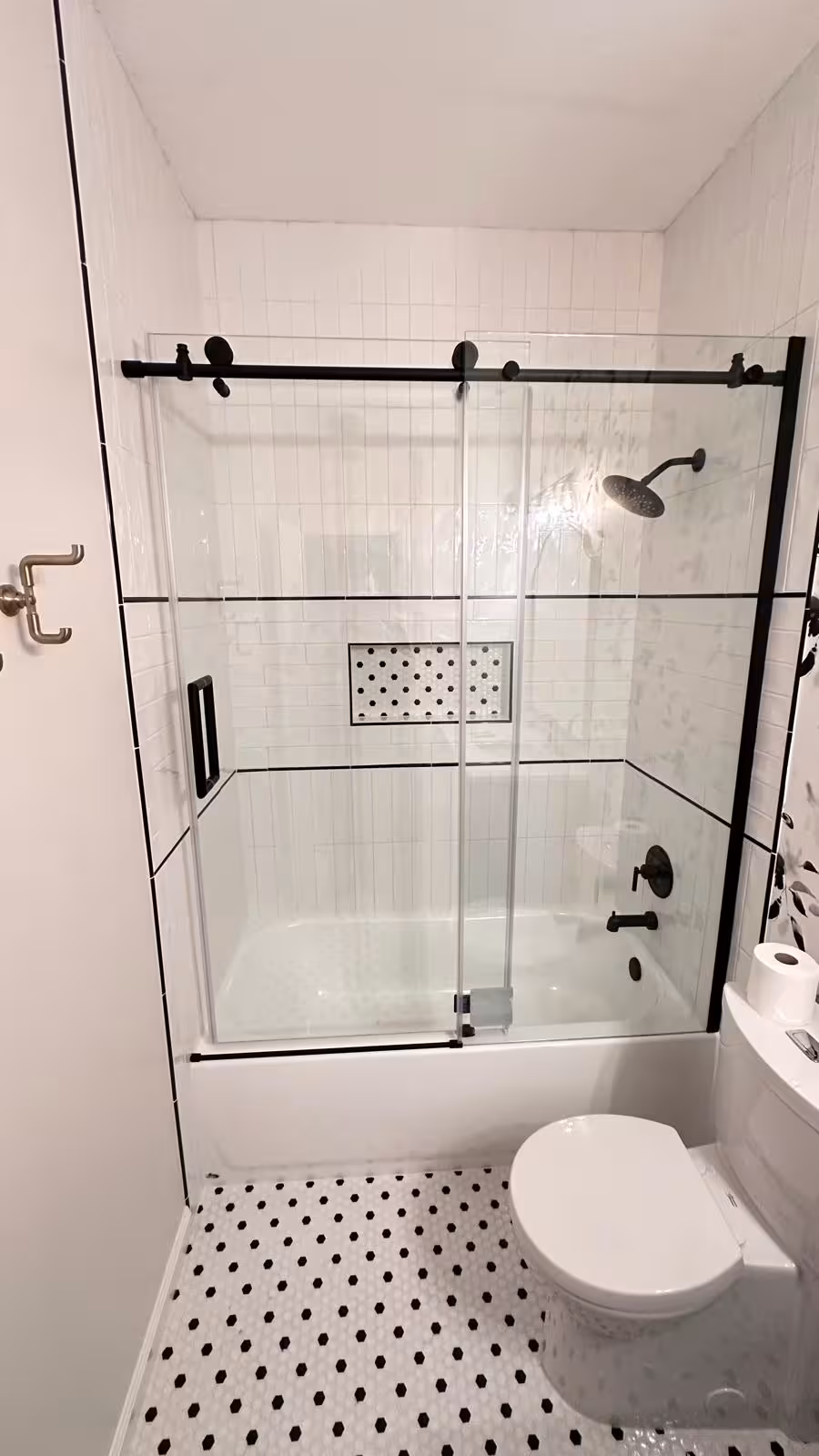 Designer bathroom renovation featuring mosaic tile work and white subway walls Arvada Colorado