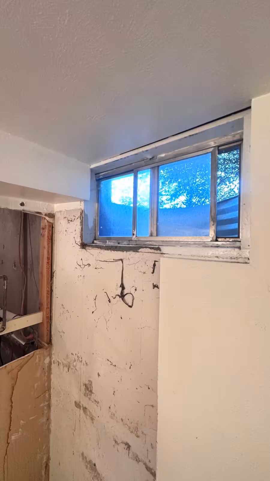 Basement bathroom renovation showing exposed walls during construction Littleton
