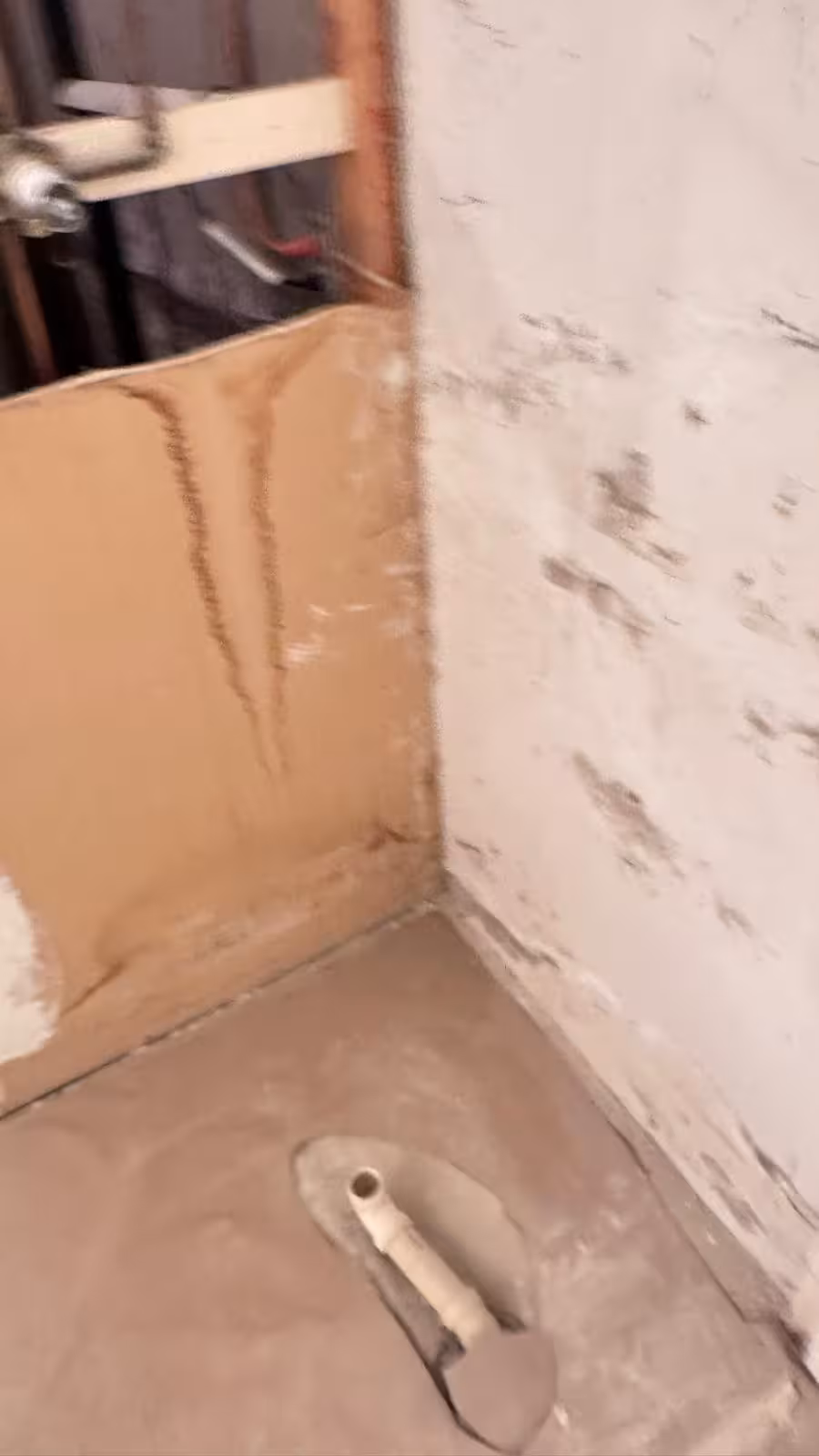 Basement shower demolition and marble tile installation in progress Littleton