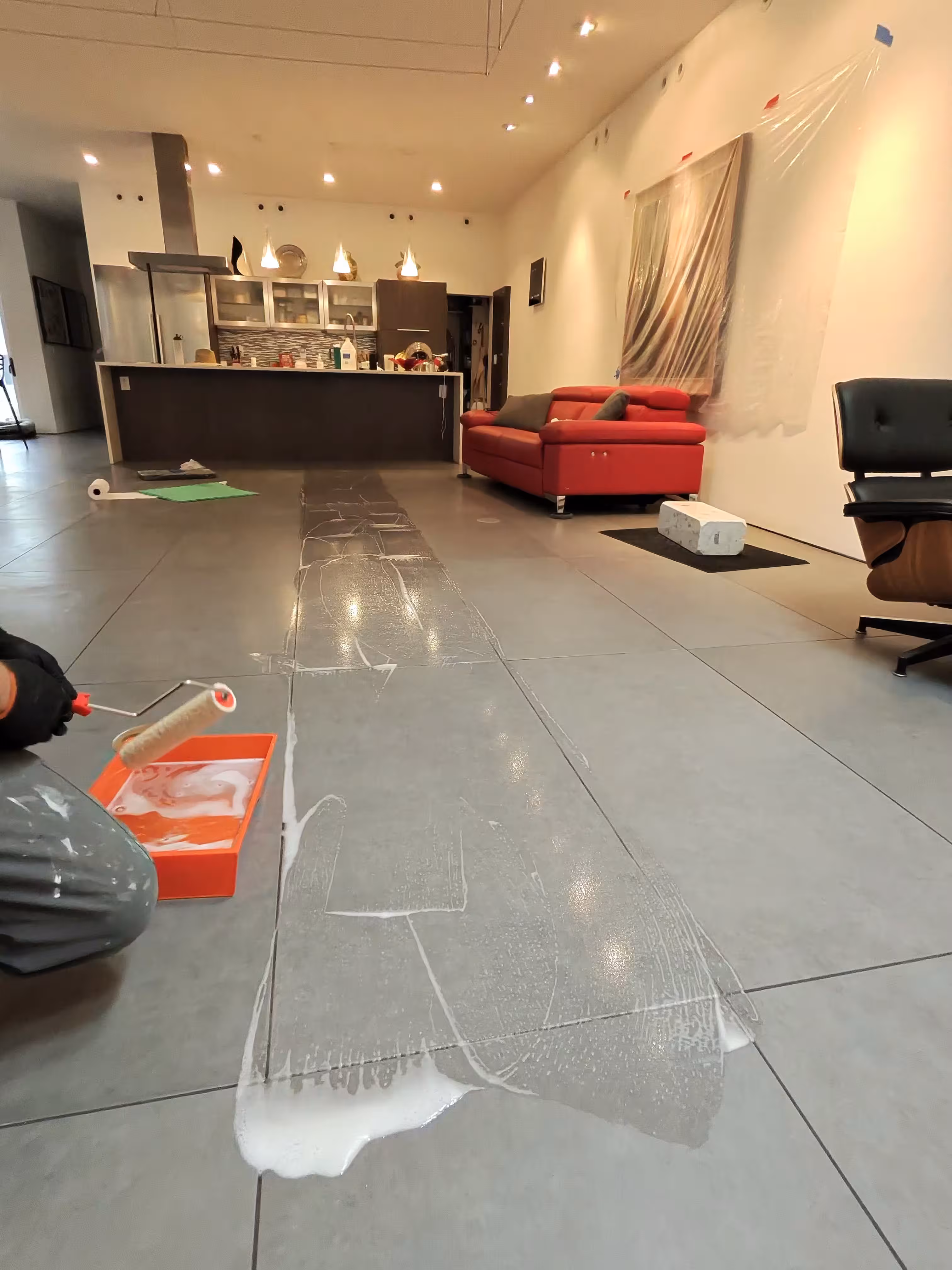 Before and after comparison showing epoxy haze removal from bathroom tile