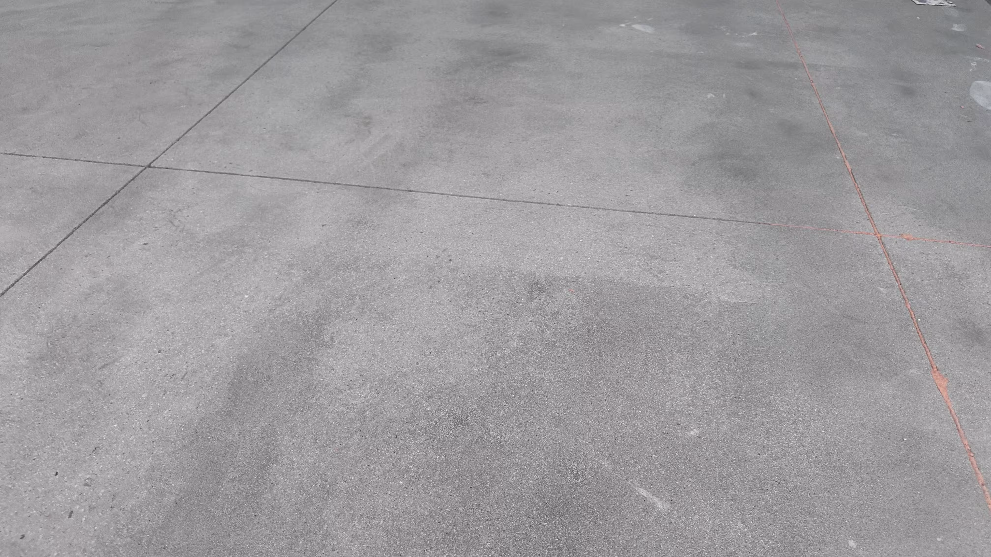Layout lines and adhesion test on prepared concrete slab
