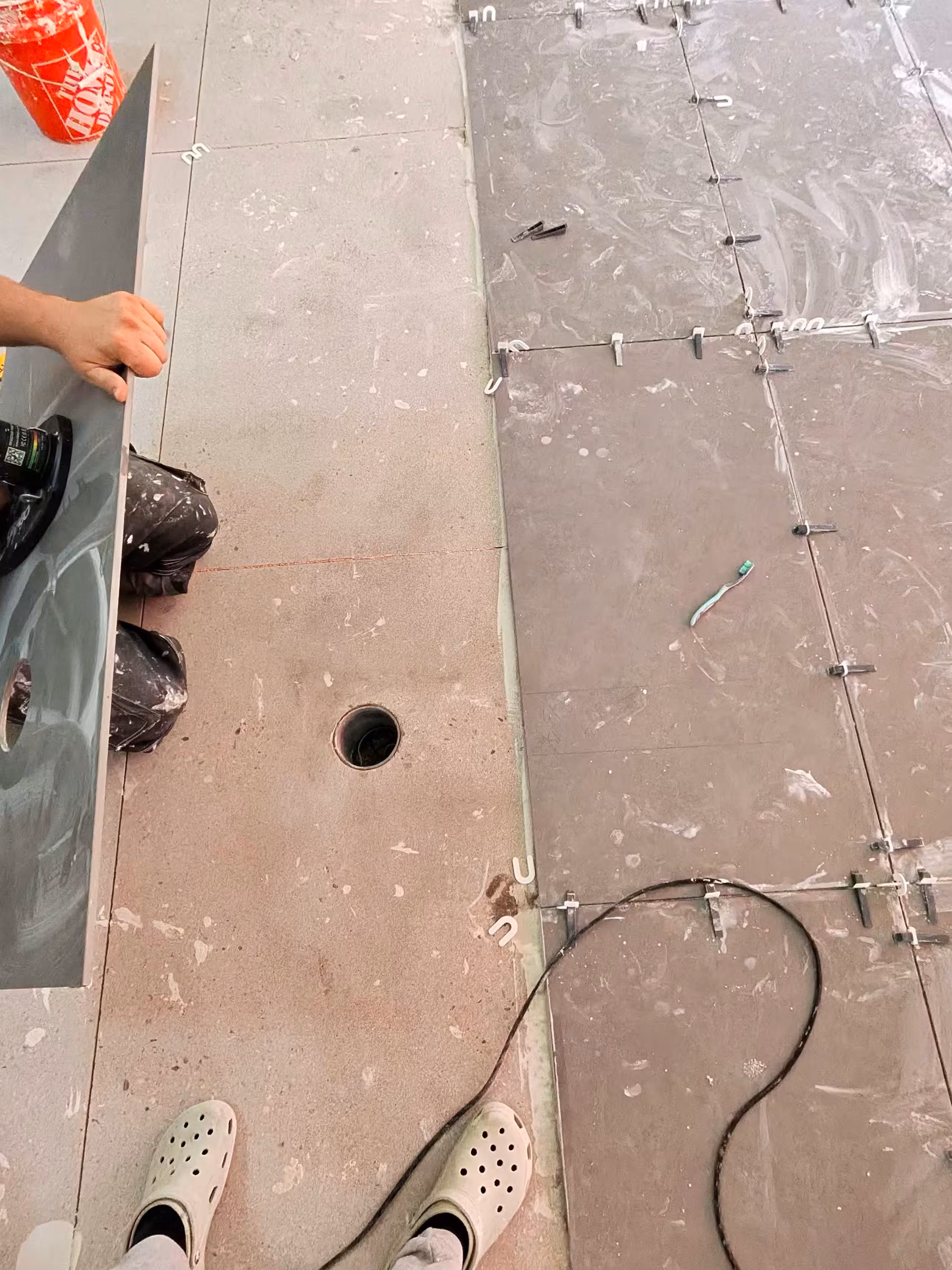 Diamond core bit drilling clean hole in porcelain for floor outlet