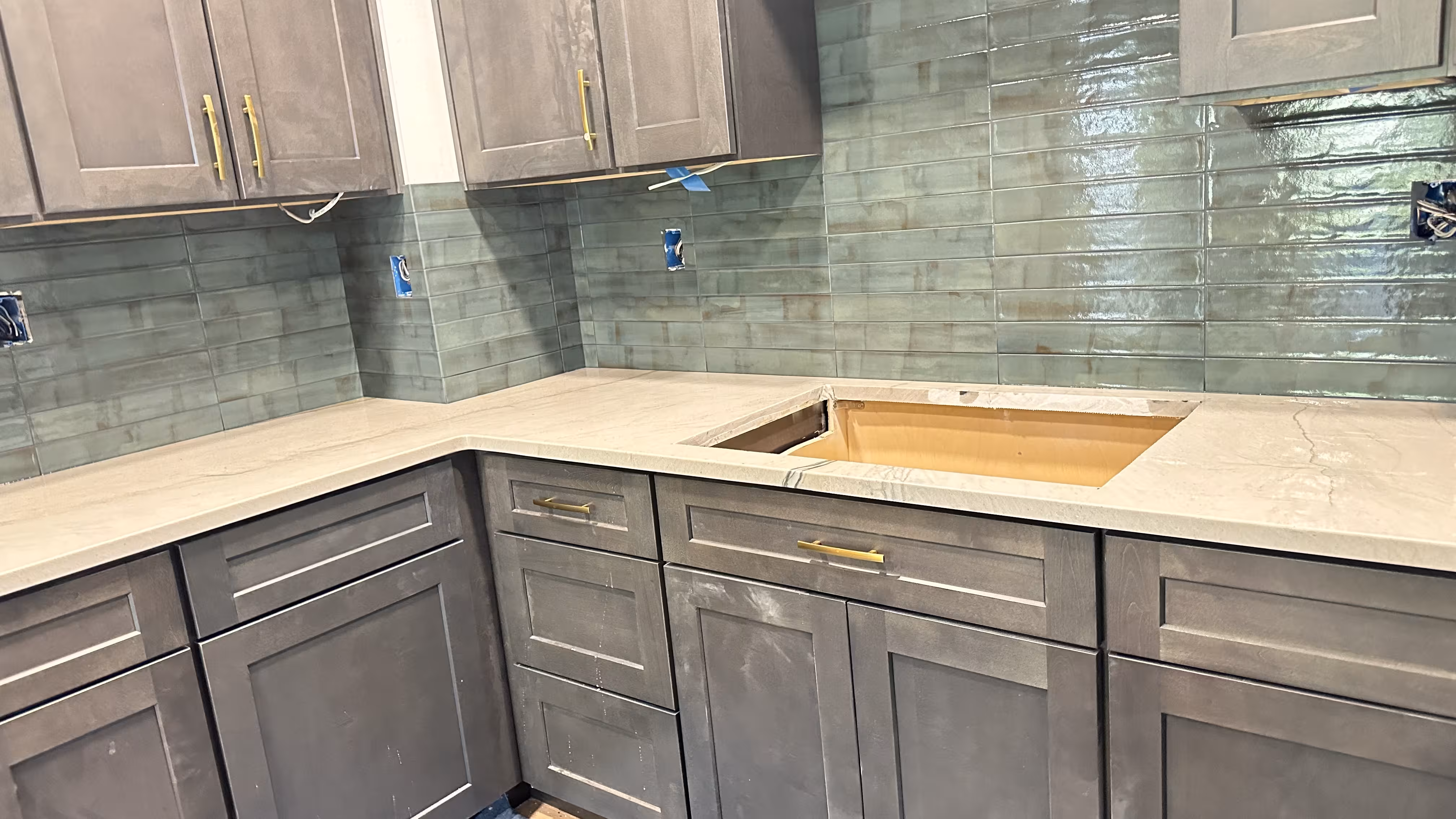 Layout planning for porcelain subway tile backsplash in Aurora kitchen