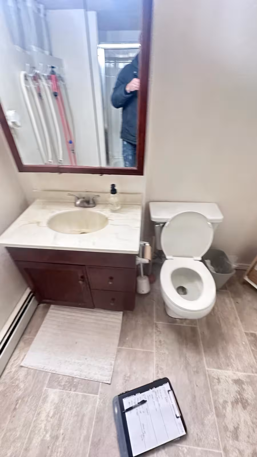 Old basement bathroom vanity area before renovation in 1980s Aurora home
