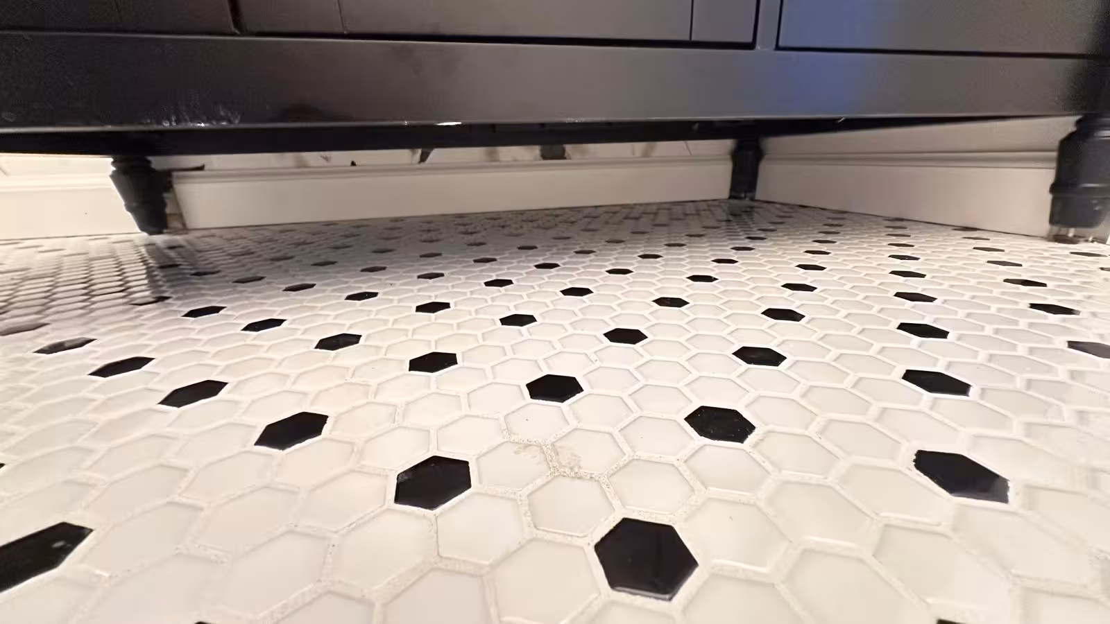 Mosaic tile floor and niche detail in completed Arvada bathroom remodel