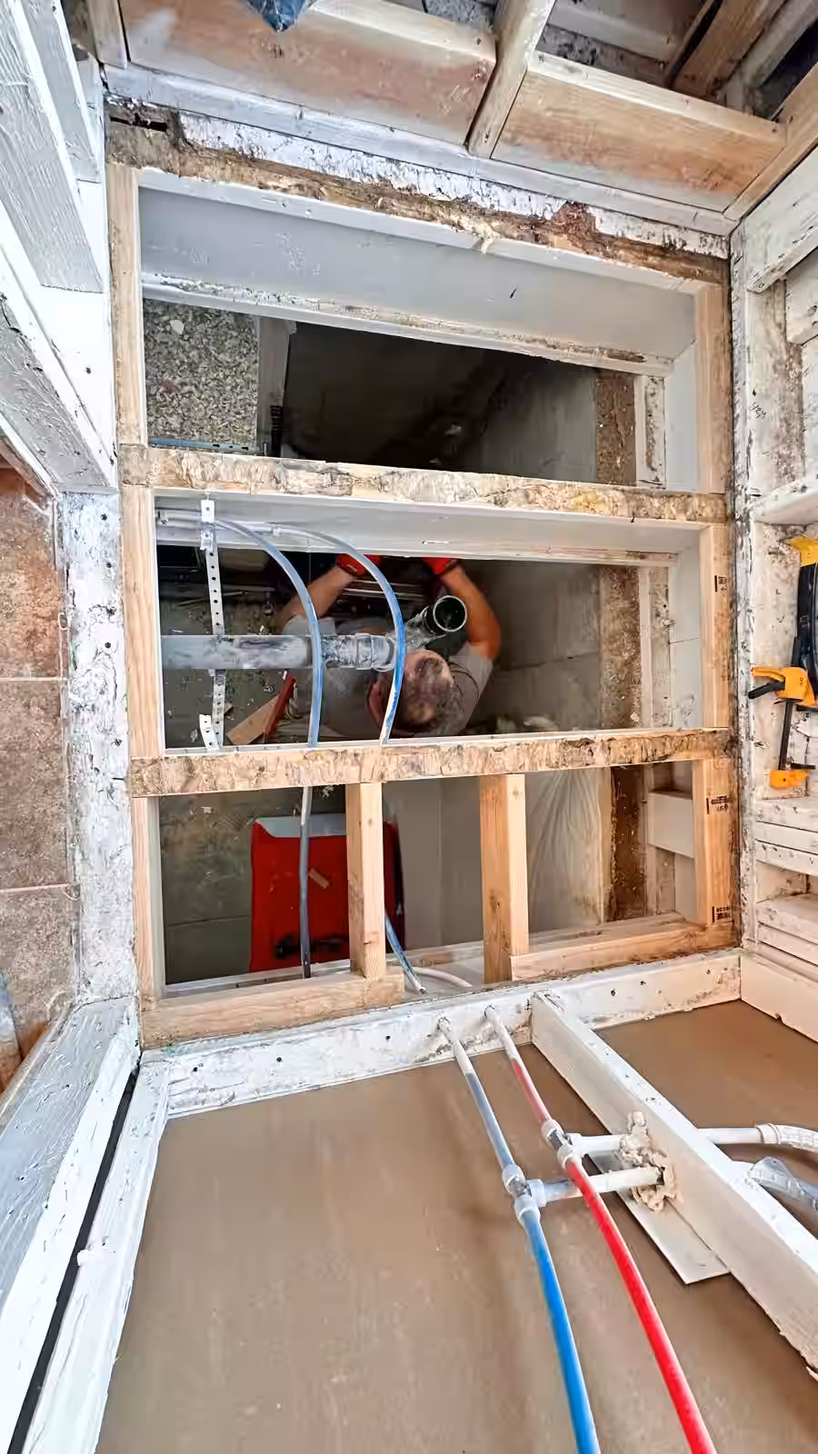 Shower floor framing with new plumbing installation and drain assembly