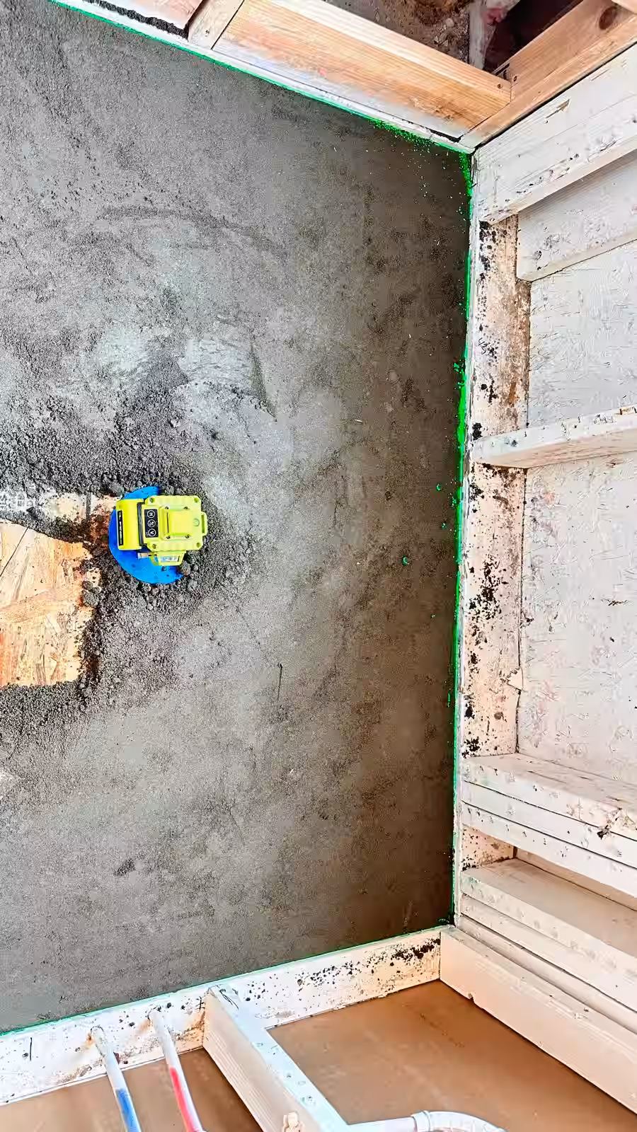 Concrete shower base with waterproofing preparation before tile installation