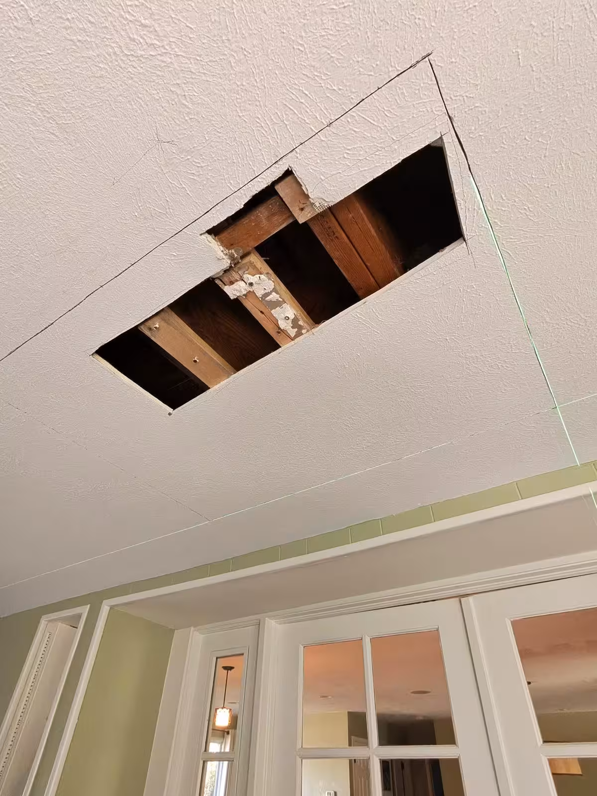 Ceiling access opening below bathroom for shower leak repair Denver