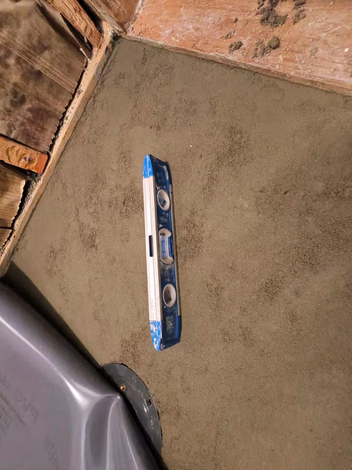 Leveling concrete mortar bed for shower pan installation Denver